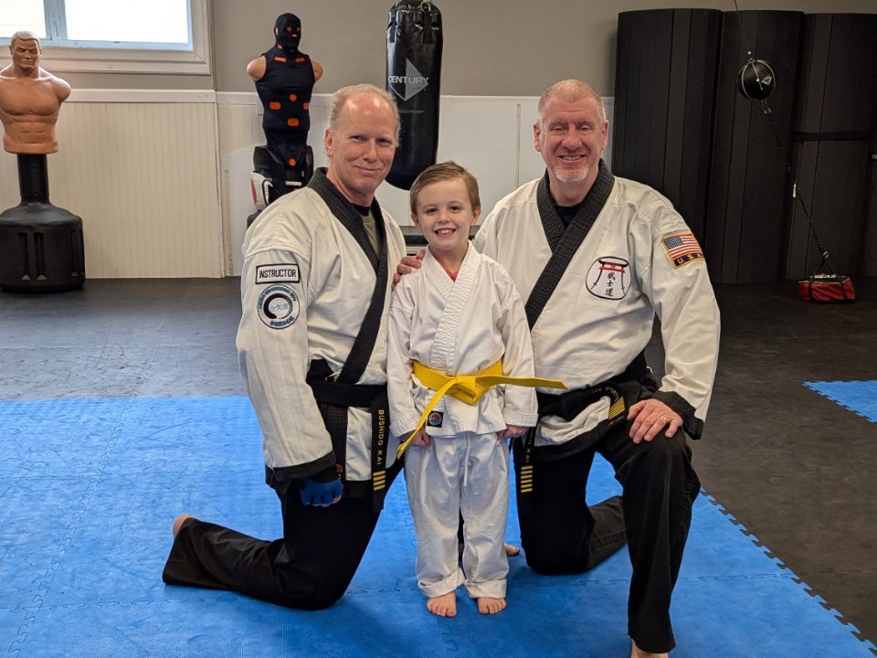 Instructors with a student after a personal training session